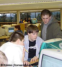 Students using ArcVoyager mapping software to answer questions about the collared bears movement patterns