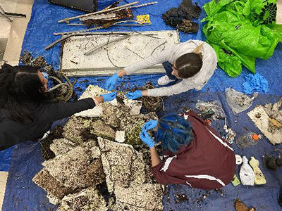 Students at Dimond High School in Anchorage sorting trash collected during a beach cleanup Photo courtesy Kim RaumSuryan