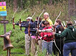 Del Demeritt and John Abrams teach an archery class at the August 2005 Becoming and OutdoorsWoman event at Lost Lake Bill Greiner photo
