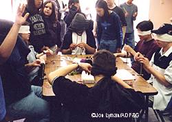 After several flytying classes students are challenged to tie a wooly bugger blindfolded