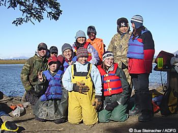 Students from the village of White Mountain teamed up with Fish and Game biologists in September to collar caribou L to R teacher Chris Brown back row black cap Paul Tomalonis red cap Becca Haviland Crystal Lincoln front yellow bibs Mi