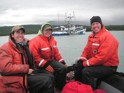Author Beth Peluso left with Sarah Schoen and Sadie Wright with the Research Vessel Curlew in the background Wright is a member of the Endangered Species Team at ADFampG Photo by Judy Putero NPS