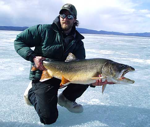 Corey Schwanke with a 25 pound lake trout caught in late April through the ice