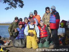 The junior high class takes a break from a busy four days of capturing and collaring caribou as they swim across the Kobuk River Front row LR Paul Tomalonis Crystal Lincoln Sarah Morris Second row LR Chris Brown teacher Hunter Gray HS student Rebecca Haviland Michelle Lincoln Leslie Shoogruwruk LB Brown and Stephanie Lincoln