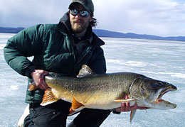 For some anglers winter is prime fishing season Corey Schwanke with a beautiful lake trout caught through the ice
