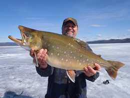 Gerald Smiley holds a 33 inch arctic char from Harding Lake Photo courtesy Dennis Musgraves