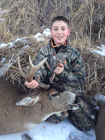 Hunter Ryan Reed with a Kodiak Island deer