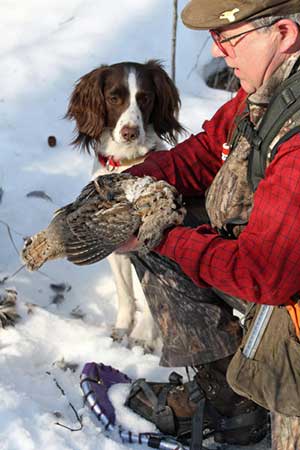 Hunter Derek Tomlinson with a ruffed grouse Photo by Ken Marsh