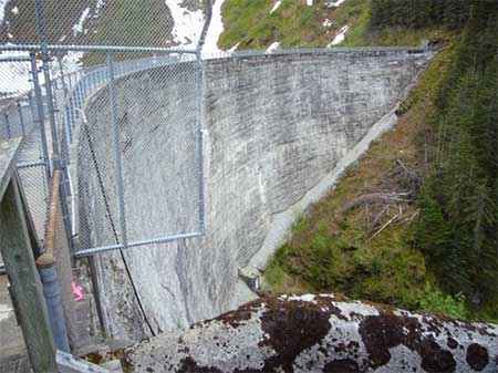 Salmon Creek Dam near Juneau Built in 19151917 In many parts of Alaska that there are opportunities for hydroelectric development that have a minimal effect on salmon Many developments use watersheds above a salmon passage barrier to produce electricity Those projects take water from a lake or stream above the barrier and return it to the stream at a point where there will be little or no effect on salmon Photo MD Miller 652012