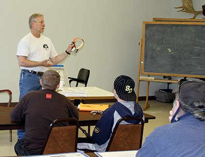 Wildlife biologist Phil Mooney explains GPS collaring technology Community outreach is an important component of the ongoing deer research project