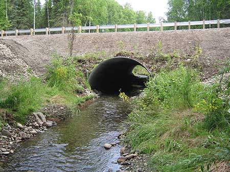 Caswell Creek tributary at Hidden Hills Road shown after culvert replacement added a fishfriendly culvert in the summer of 2012 Partners on this project included the MatanuskaSusitna Borough and the US Fish and Wildlife Service Coho salmon use this creek for spawning and rearing and an adult salmon was observed upstream of the culvert three months after replacement Salmon had not previously been recorded upstream of the roademem
