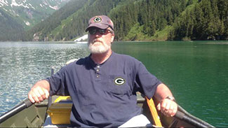 The author rowing ndash not motoring ndash across Turner Lake because someone forgot the outboard gas on the floatplane ADFampG operated a lake level gage on Turner to collect the information needed to get a water right to protect the natural lake levels of this trophy cutthroat trout lake Go Pack