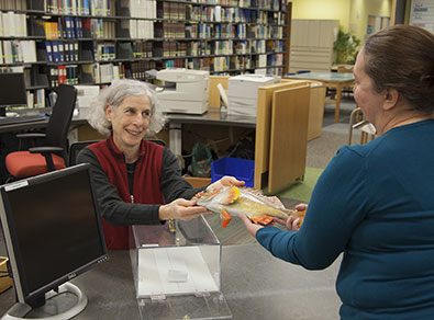 Celia Rozen checking out a fish Photo by Cody Swanson