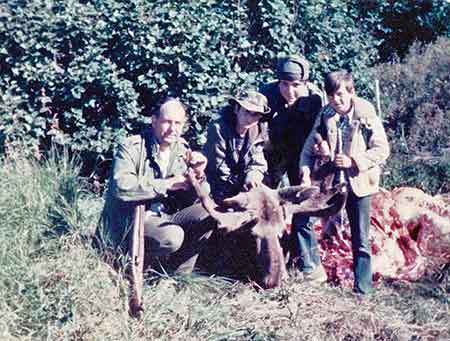 Alaska hunters 1970 Young Ken Marsh in the bush hat with his uncle Norwood Marsh to the left and cousins Pete Marsh and Rodney Marsh to the right with a moose taken near the Denali Highway