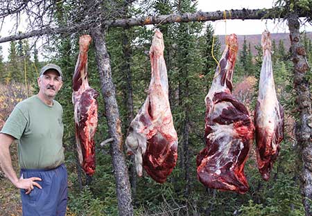 Moose hunter Kim Titus with moose meat from a successful hunt Kim Titus photo