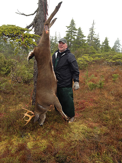 Author Mark Stopha with a Southeast Alaska Sitka blacktailed deer For Alaska residents proxy hunting regulations are in place allowing resident hunters to harvest certain fish and game species for residents with a disability or who are at least age 65