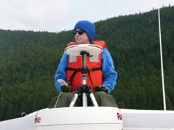 Kira Pontius REU intern observes murrelets along a boatbased transect in Stephens Passage