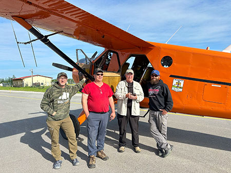 Mike Ebinger the asisstant area biologist at McGrath Al Barrette pilot Bruce Dale and Nate Pamperin in McGrath with the Fish and Game 1951 DeHavilland Beaver