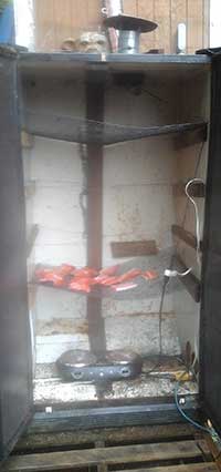 A smoker made from a recycled fridge