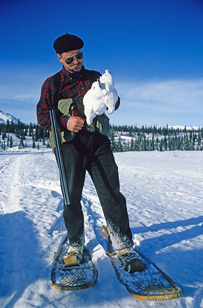 A hunter uses snowshoes to pursue ptarmigan in winter Photo by Ken Marsh