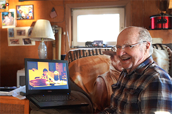 Don at home in 2020 reviewing family photos he39s scanned