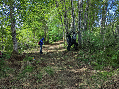 Community members from Shageluk and Holy Cross construct a soft release pen for bison in July 2022