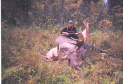 Author Art Hughes with a western Alaska moose Photo by Joe Chythlook