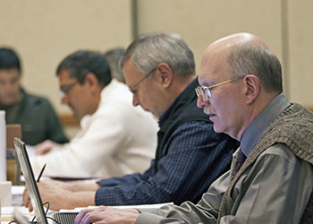 From right Anchoragebased Subsistence Program Manager James Fall Acting Director of Wildlife Conservation Dale Rabe and Deputy Commissioner Craig Fleener take notes during the Board of Game meeting in Anchorage January 2012