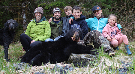 The Dittman family with a black bear after a family bear hunt Photo by Gavin Dittman