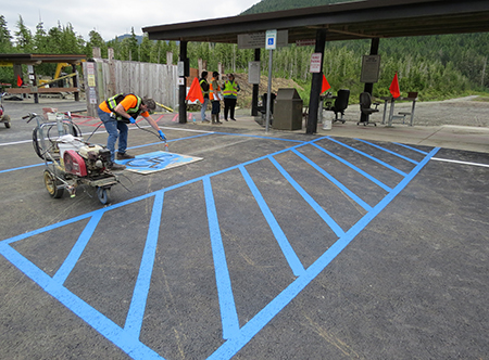 Final touches are made to the Hank Harmon parking lot in late July