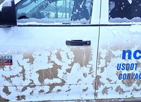 This white truck is grimy brown with dirt The white spots are quotcleanquot patches made by tongue marks