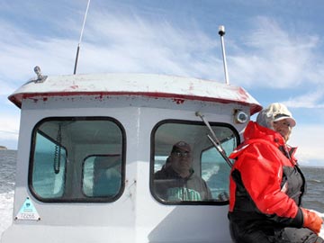 John and Pearl Goodwin searching for seals to tag in Kotzebue Sound